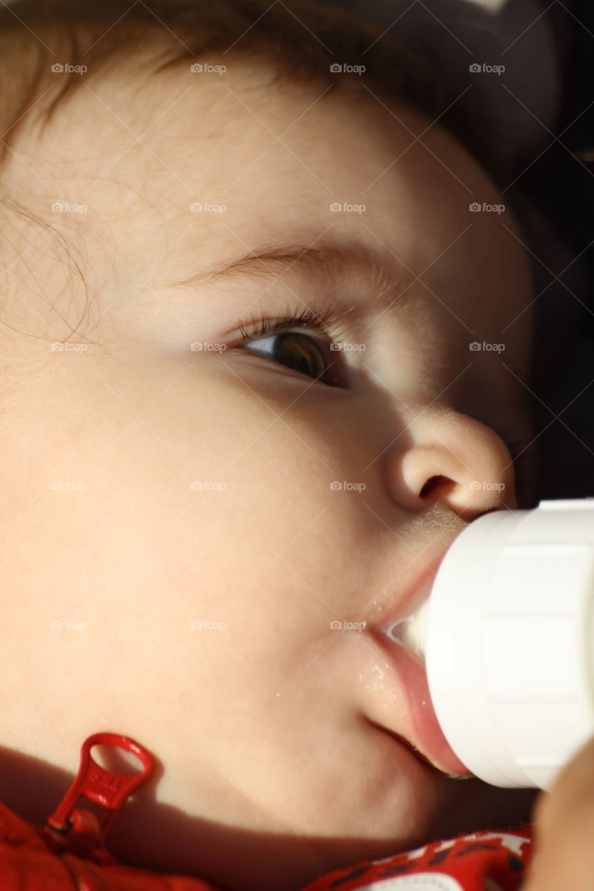 Close-up of baby drinking milk