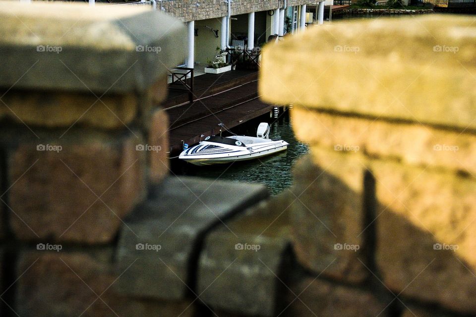 This boat was beautifully framed by the cobble stone wall