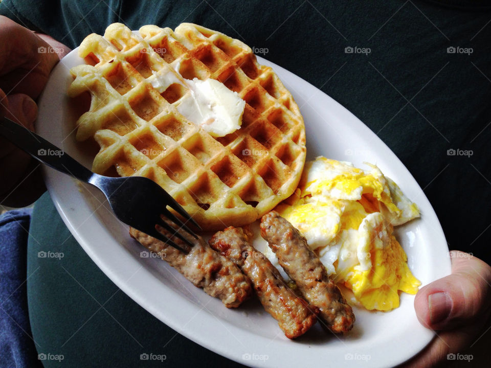 Eggs, sausage and waffle breakfast