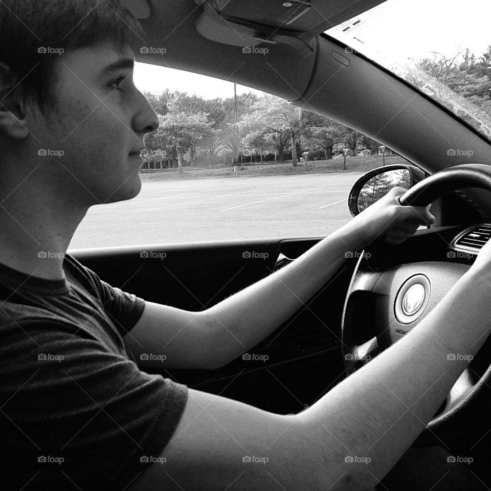 Concentration . My son's first time behind the wheel.  😊