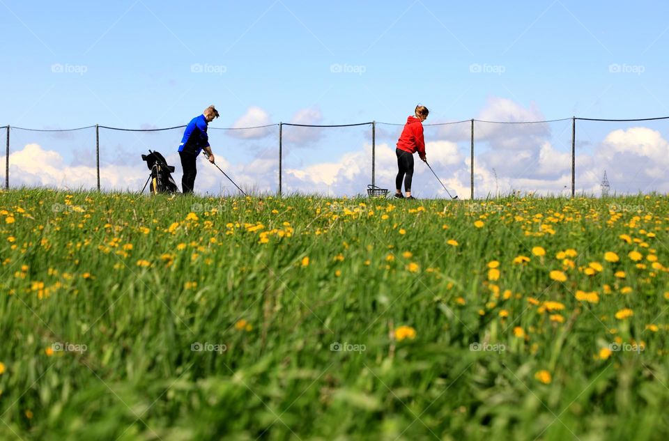 Lovers playing golf