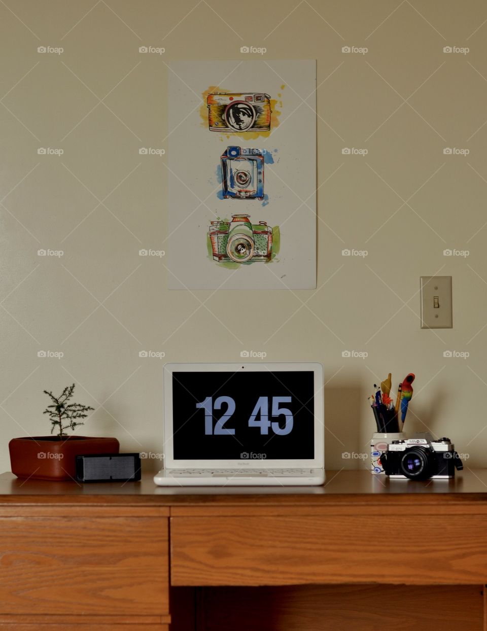 White MacBook on wooden desk