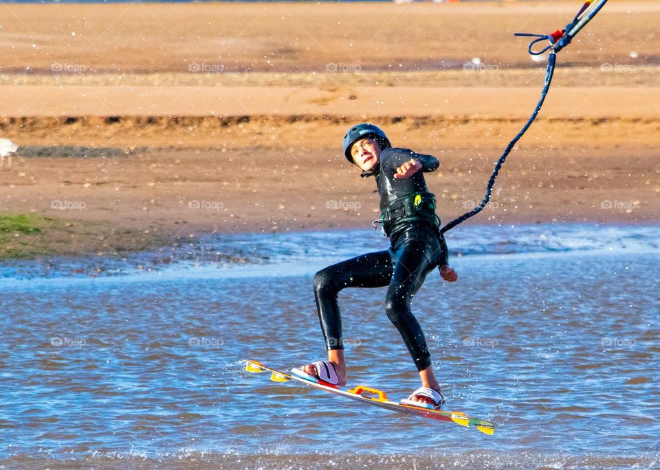 kite surfer leaps into air
