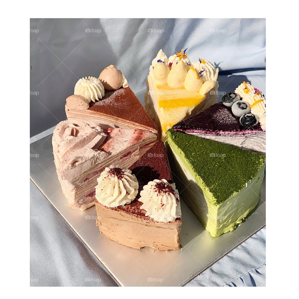 Mille crepe cake in 6 different flavours, matcha, chocolate, blueberry, raspberry, passion fruit 