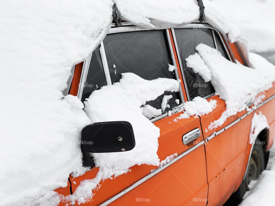 Snow covered car