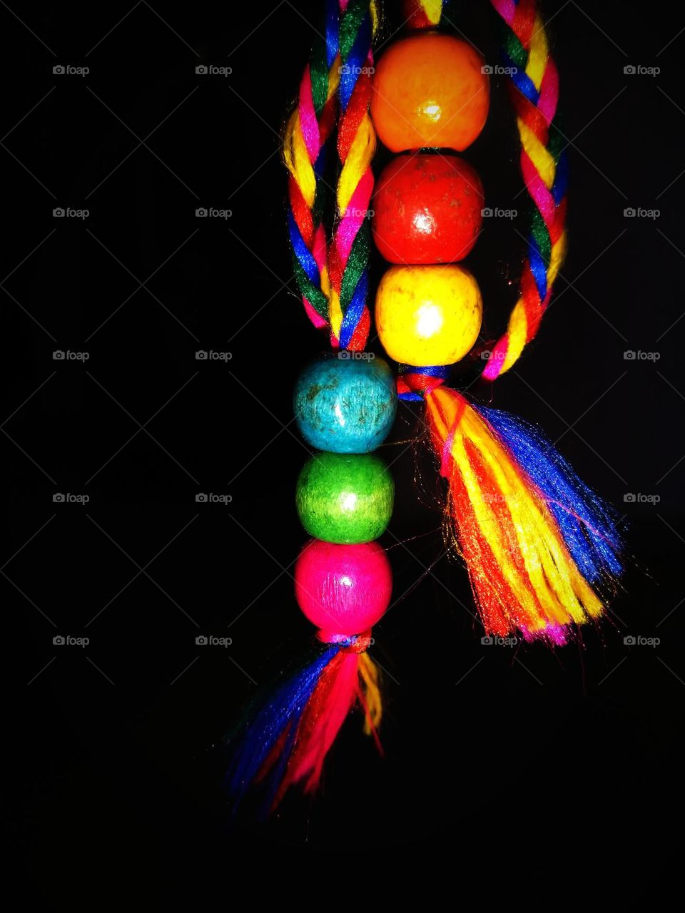 colourful beads hanging in colorful thread