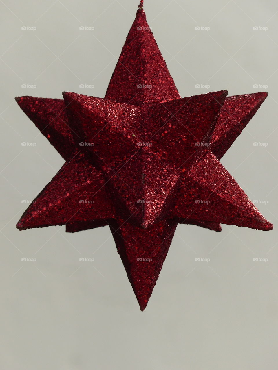 Sparkly red star white background 