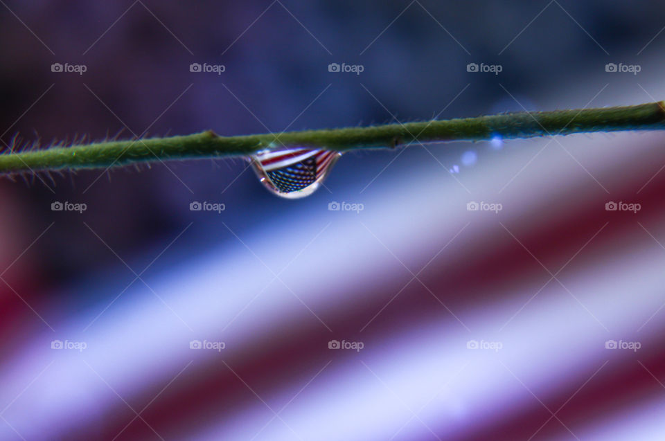 American flag reflecting on a droplet 