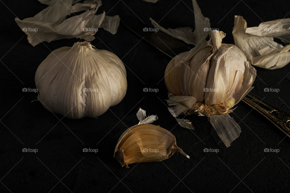 Garlic cloves dark photo