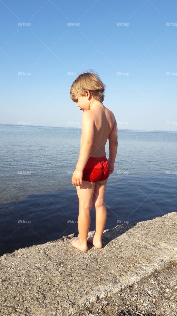 boy looking at the sea