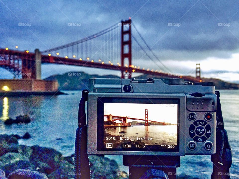 A photo display of a photographers camera taking a pic of the Golden Gate Bridge in San Francisco, CA. 