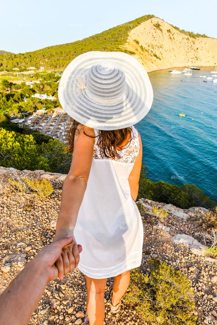 Person holding hand of woman