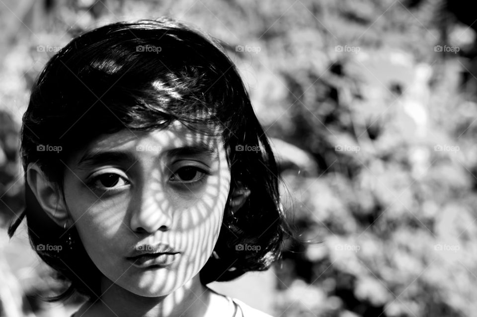 Shadow on young girl's face.