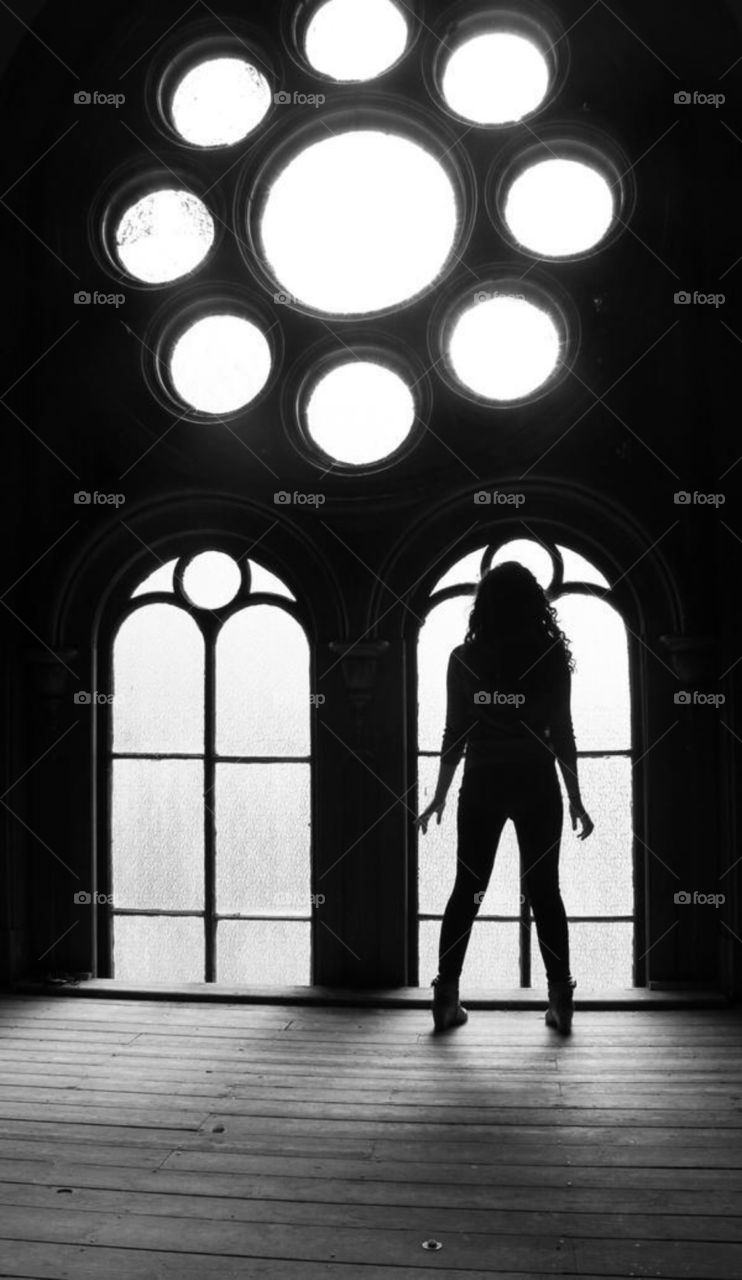 Silhouette of girl in window 