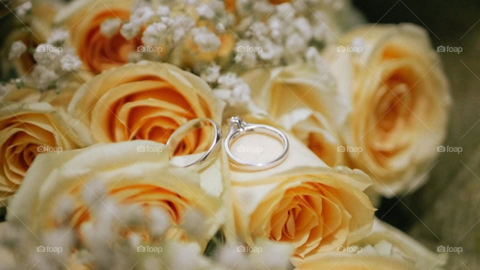 wedding ring in the middle of a rose