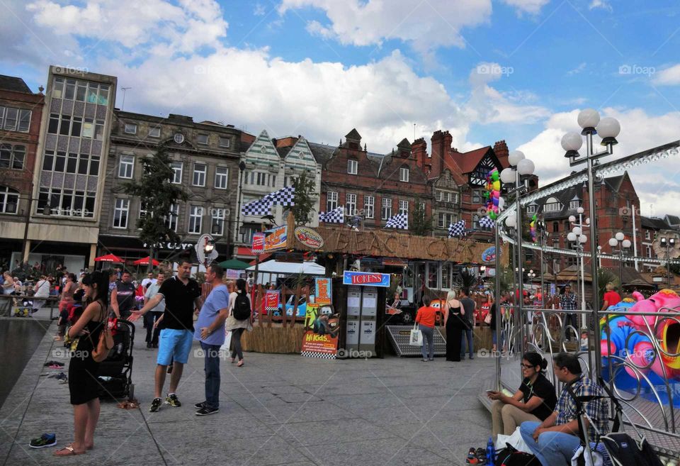 city life. People enjoying summer at Old Market Square in Nottingham,England