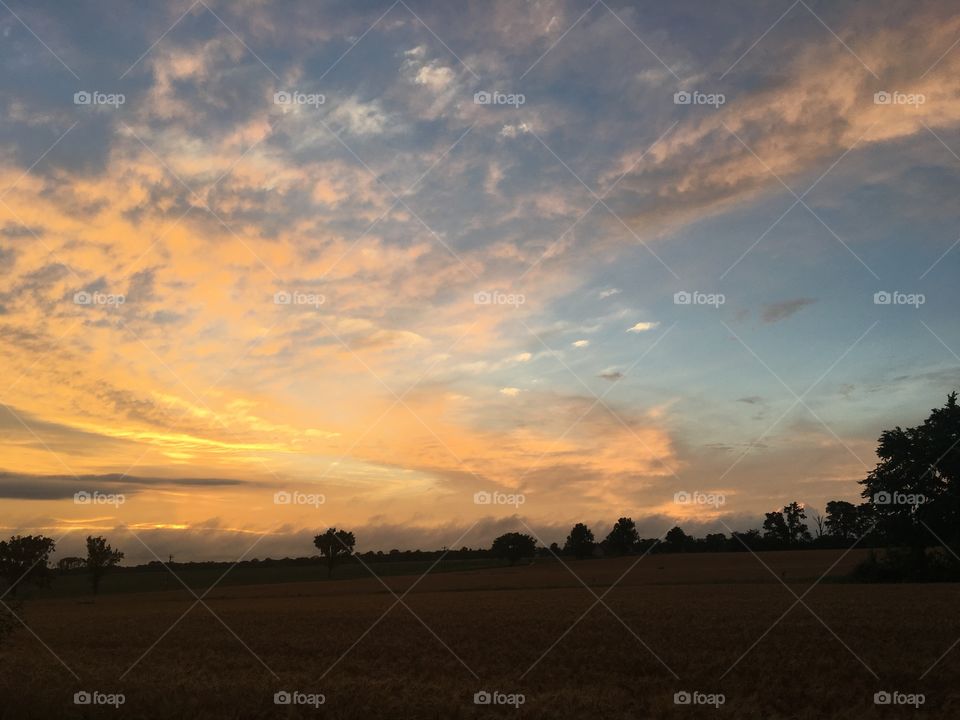 Summer rural sunset after storm