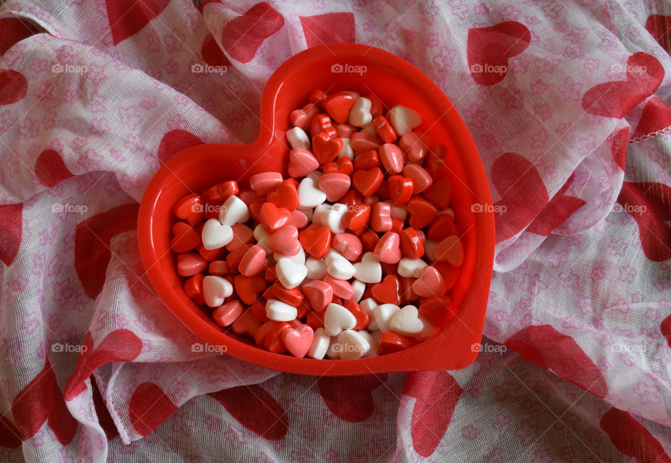 Heart shaped dish full of Valentines candy