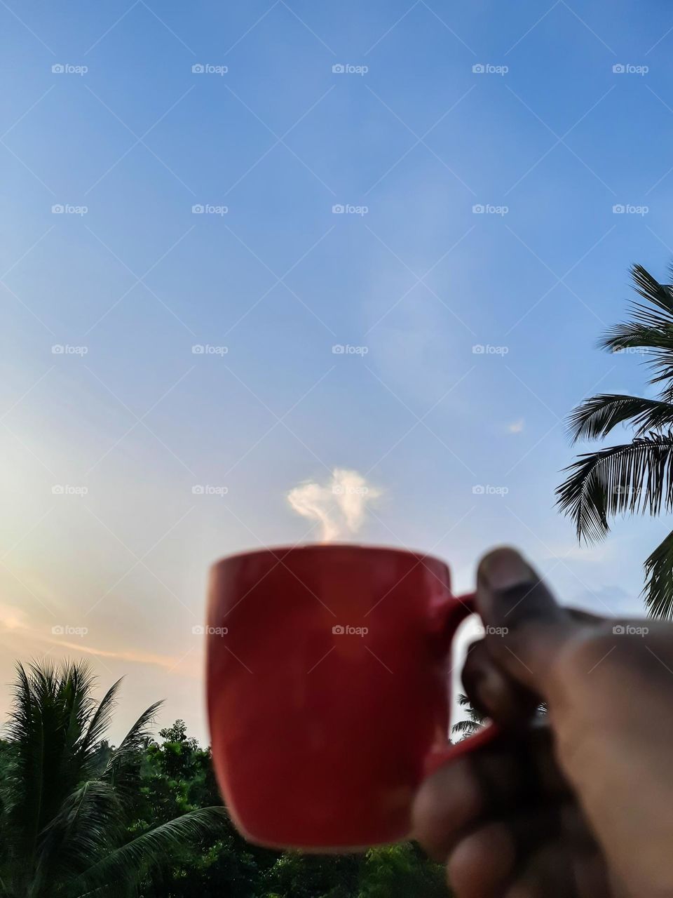 Clouds look like smoke coming out of a cup of tea