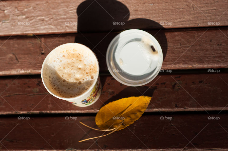 Cup of take away coffee from above  