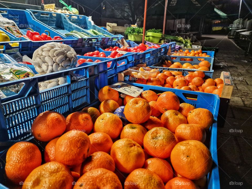 Tangerine season. Vegetables and fruits at the market.