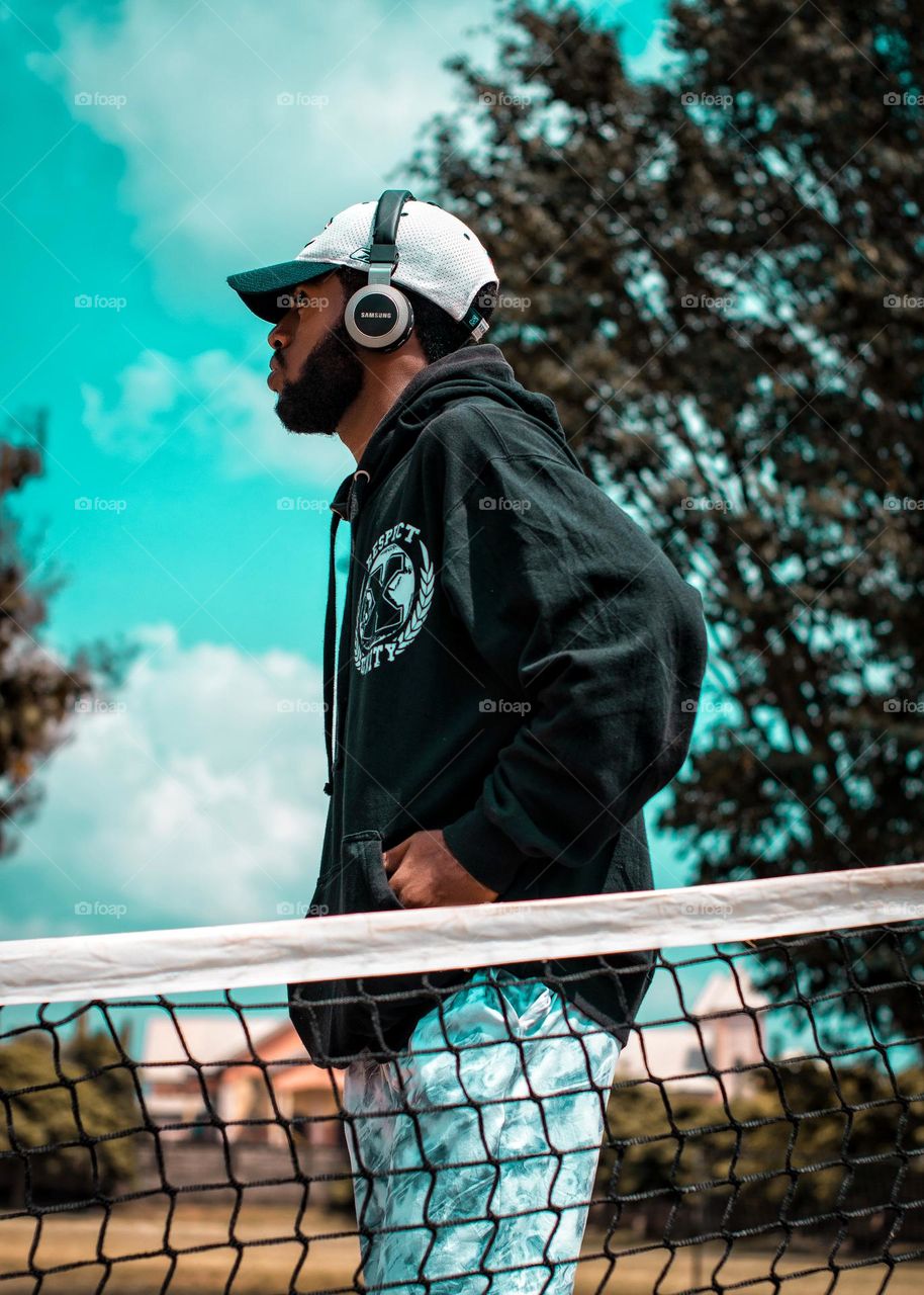 Street outdoor photography with a nice hoodie, joggers and a cap