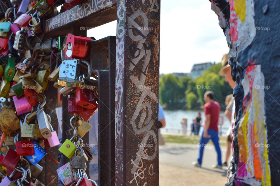 A small gate that open to East and West Berlin now filled with love locks