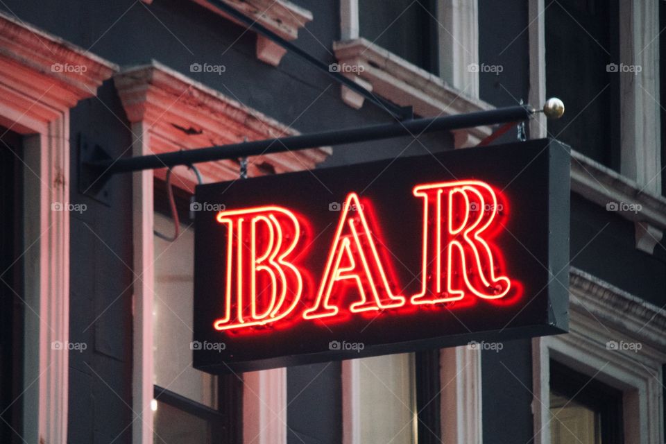 Bar sign in the city 