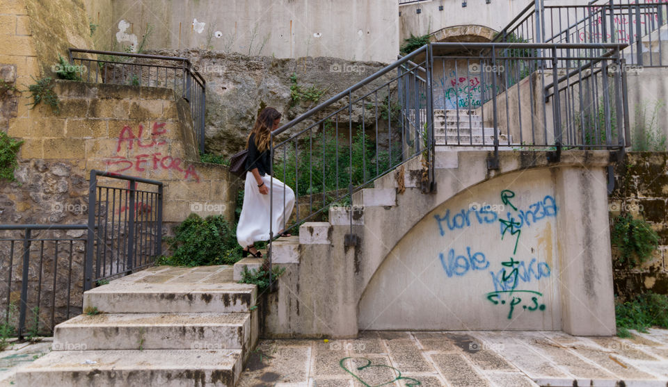 Woman walking on staircase