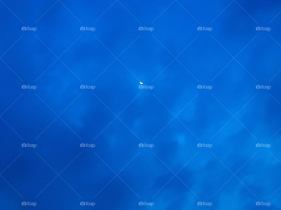 crescent moon, blue skies