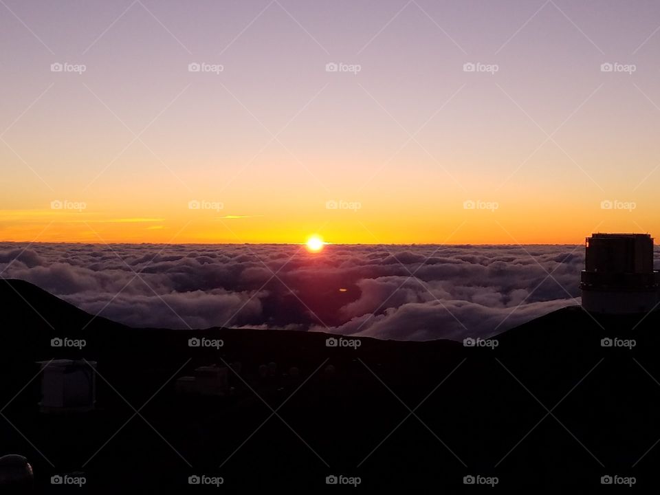 Stunning sunset above the clouds