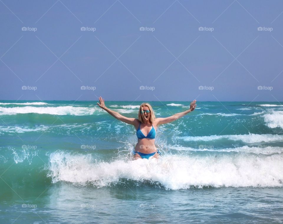 Girl in the waves at sea