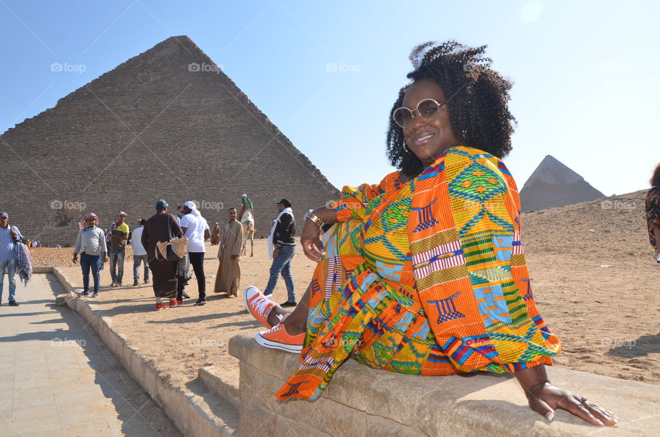 very beautiful photo great pyramid with her style hair and Colo her dress very amazing