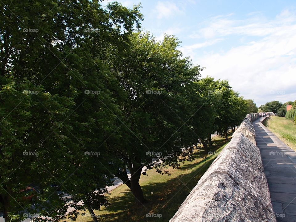 The historic fortified York Wall made of massive stone and a nice walkway surround the older parts of the city. 