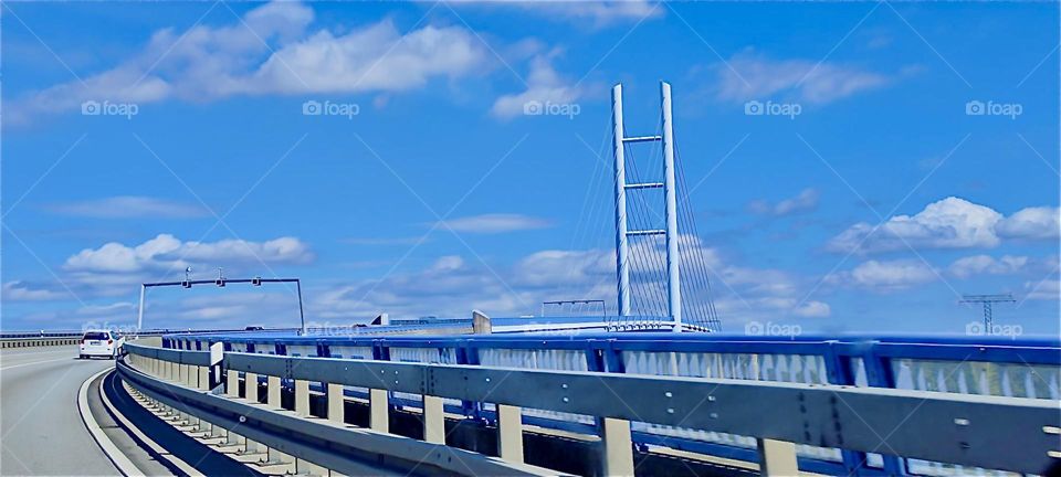 This is the crossing on the “Rügenbrücke” to the island of “Rügen” over the “Strelasund”, a part of the “Baltic Sea” by the city of “Stralsund” in “Mecklenburg - Western Pomerania”, Germany. 2024. Hypnotic Productions