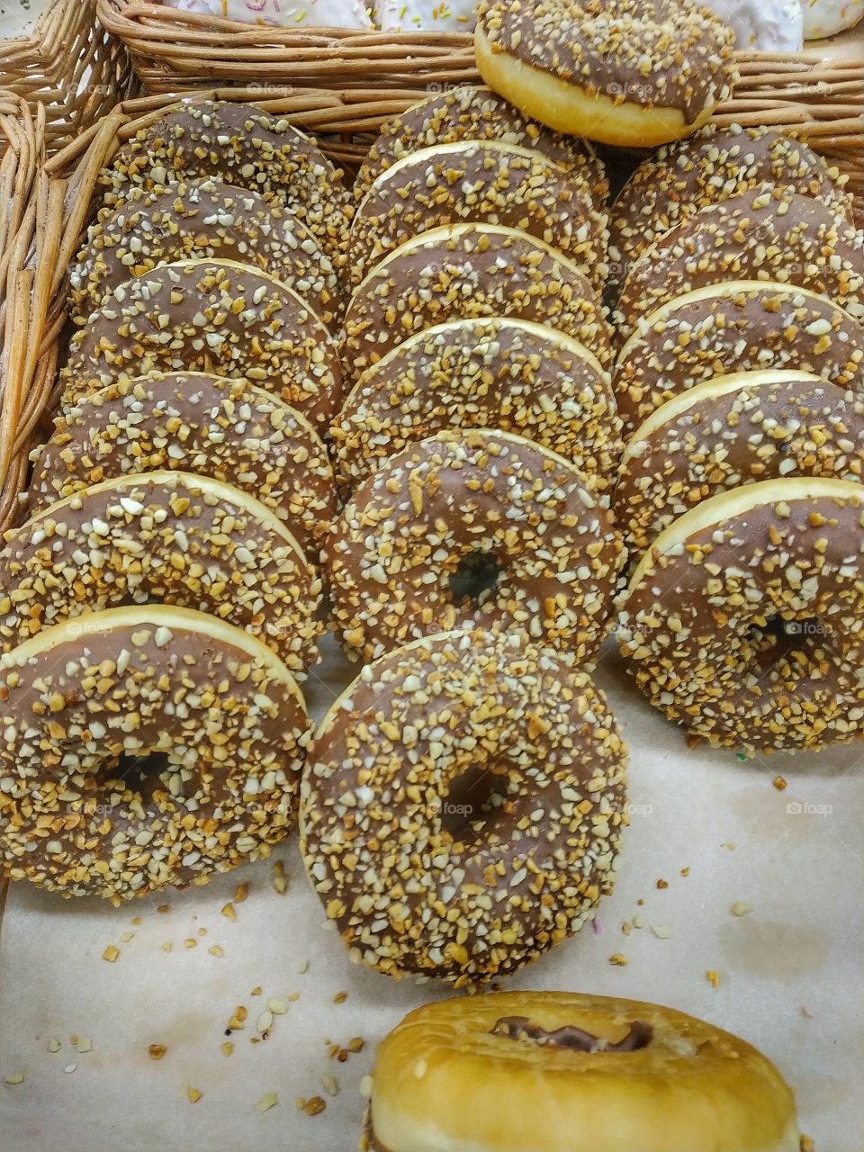 Fresh chocolate donuts in a basket