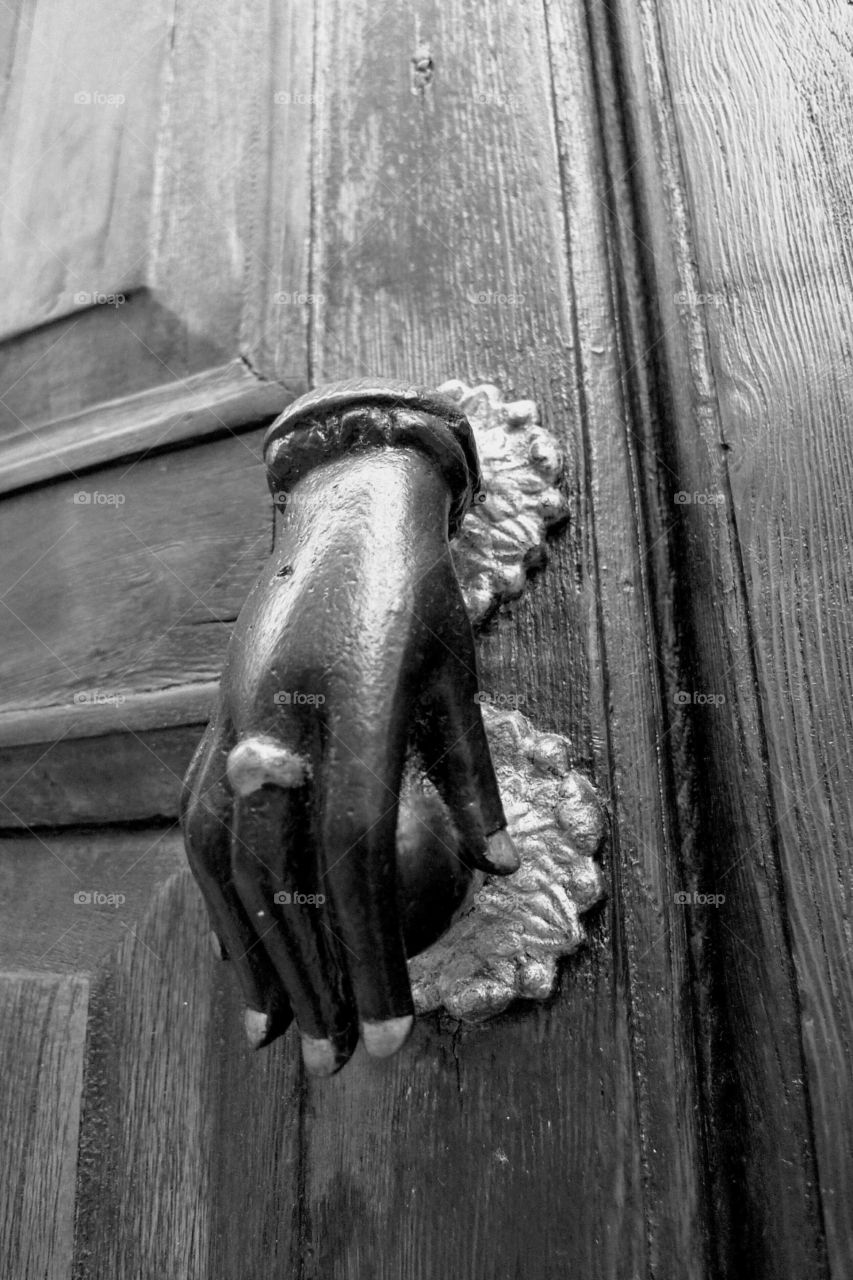 doorknocker in form of hand, black-and-white