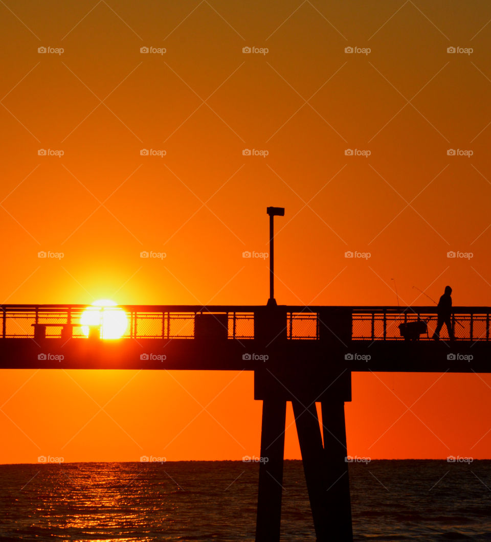 Radiant sunset over the Gulf of Mexico!
The brilliant sunset Shimmers and glows as it casts a shadow during its descent!