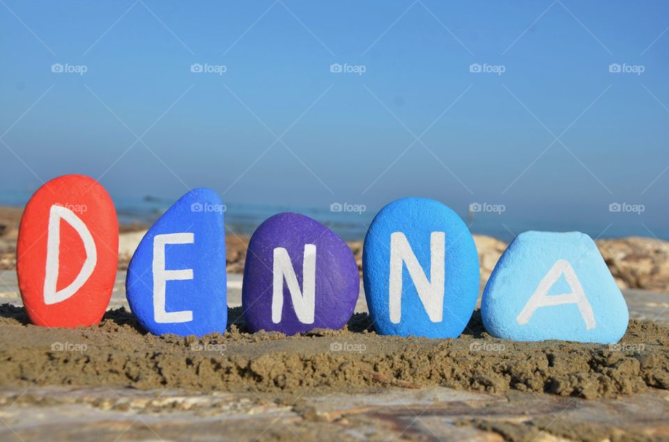 Denna, female name on colourful stones