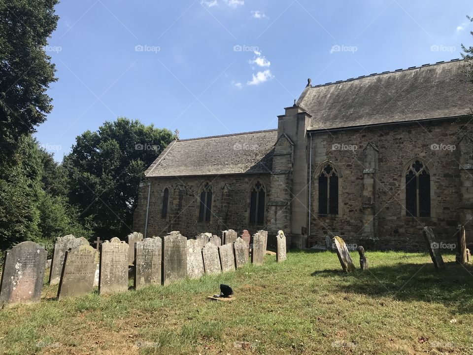Church in England with rows of gravestones
