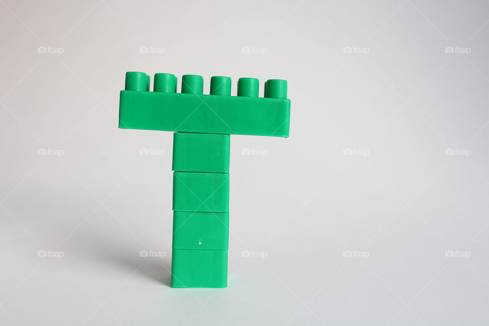 green T symbol from bricks