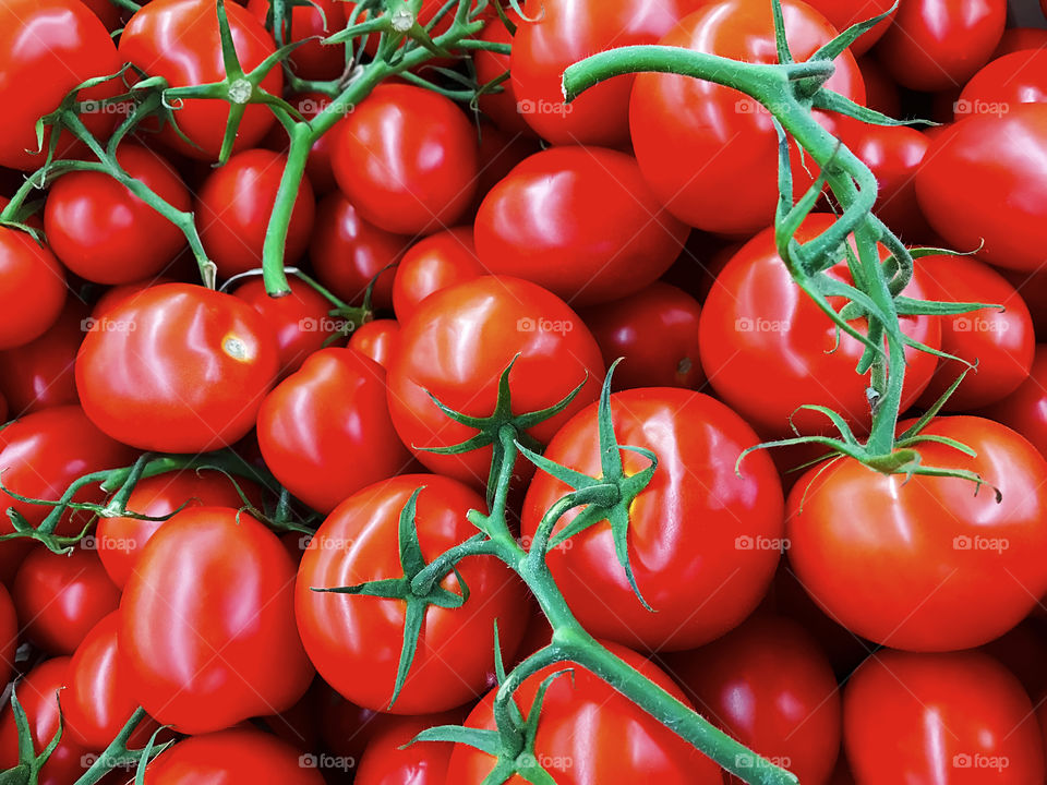 Red tomatoes with green peduncles