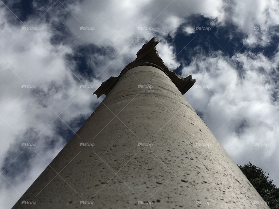 A stone pillar reaching to support the sky. 