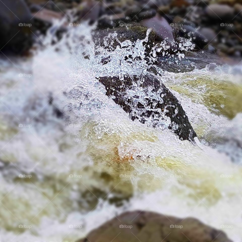 fresh water washing over a rock