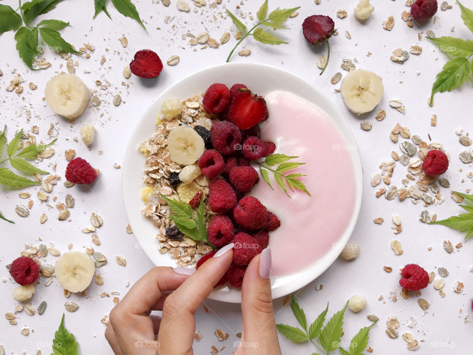 Healthy breakfast with red berries, yogurt and muesli 