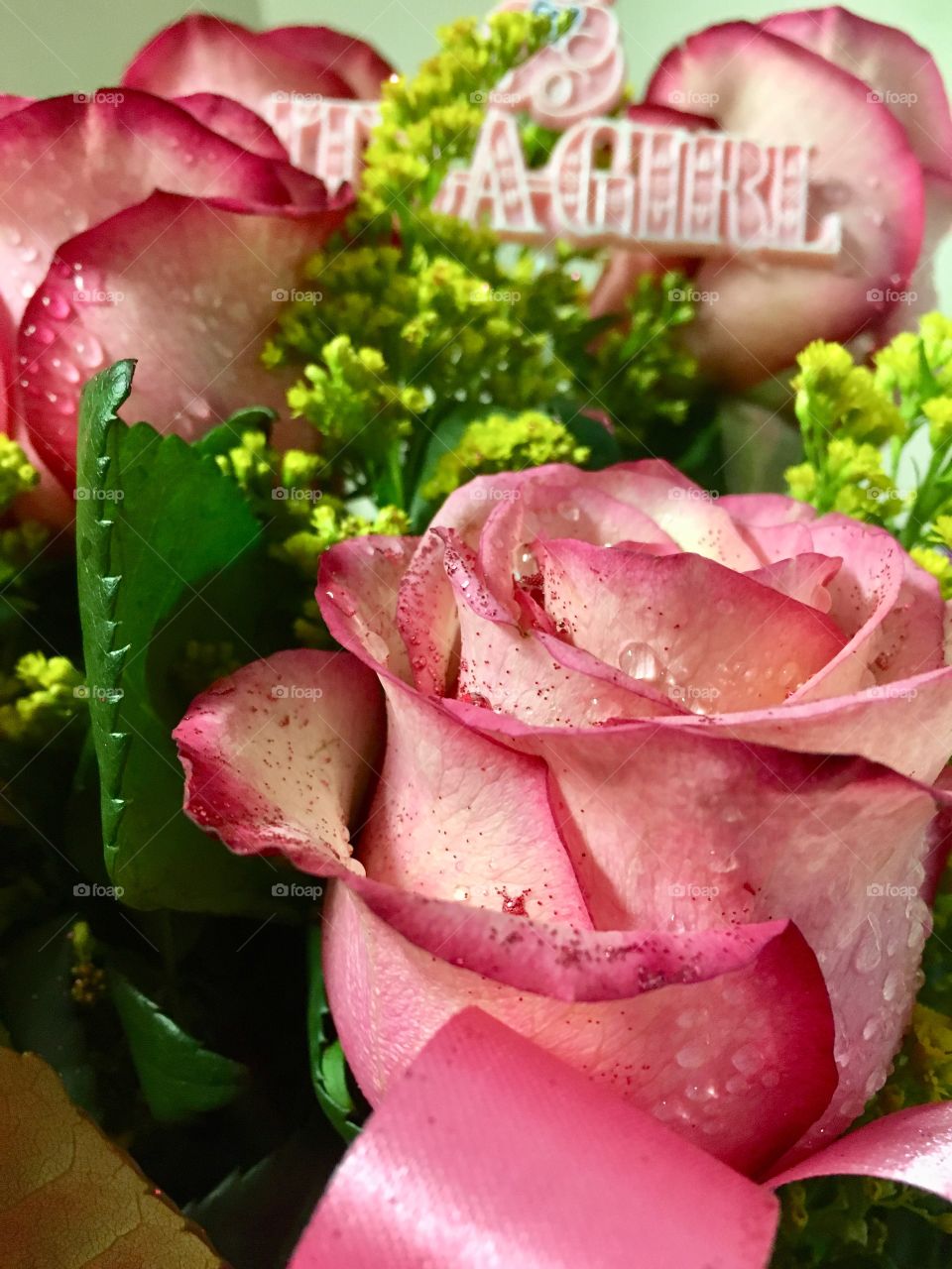 Pink glitter covered roses in a congratulations bouquet 