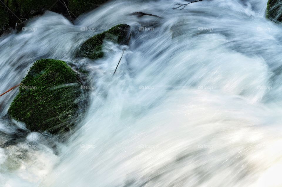 waterfall in the river in the spring park in Poland