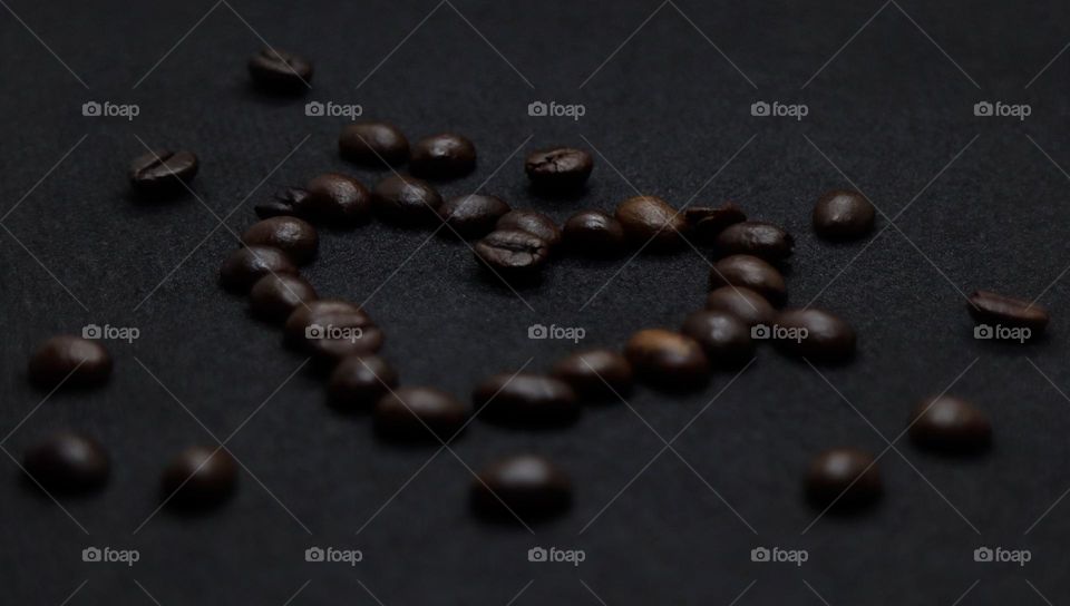 coffee beans in heart shape, view from the left