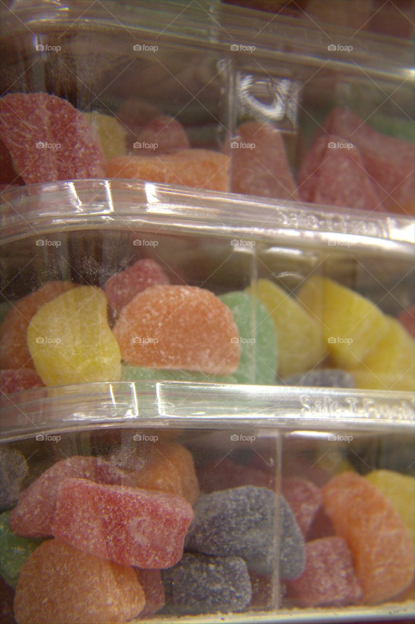 Stacked Plastic Containers of Sugar Covered Gum Drops