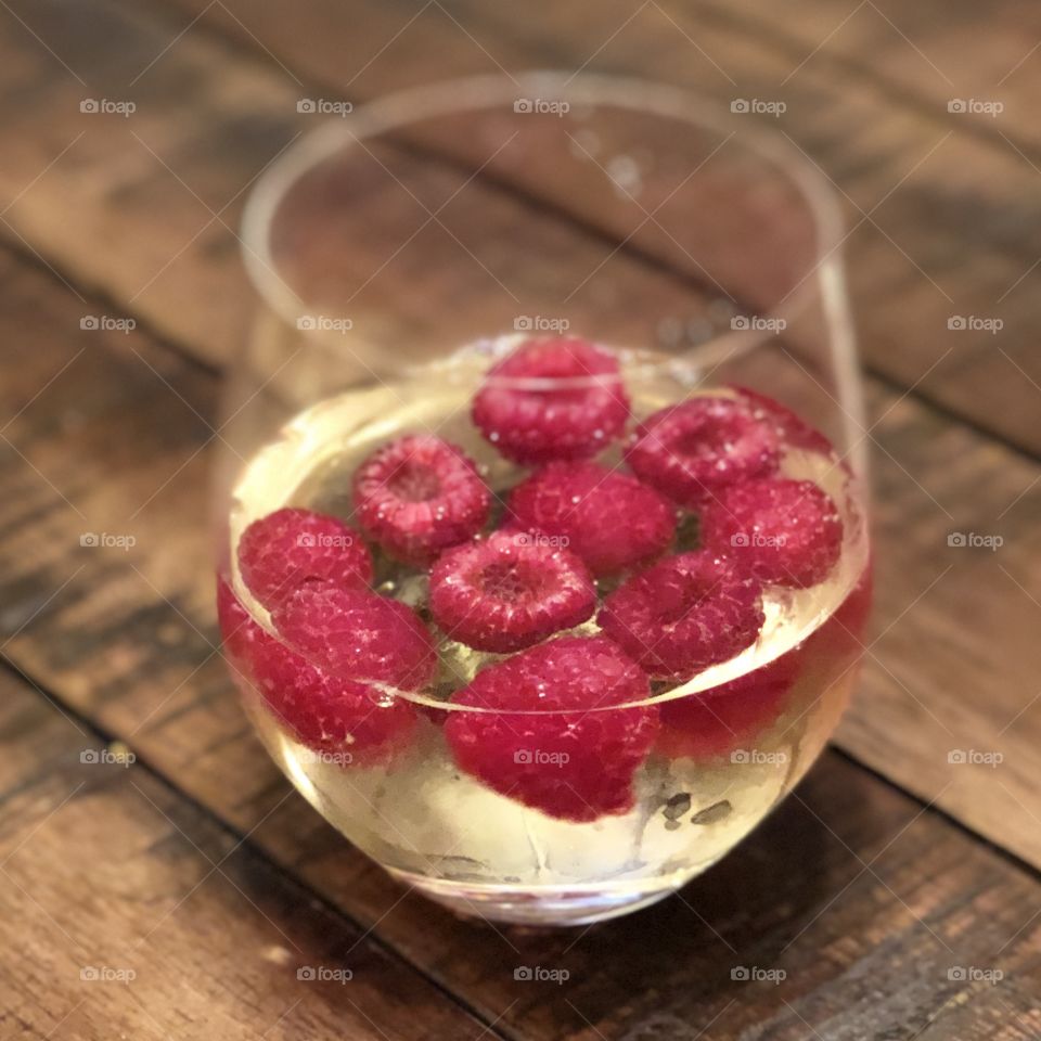 Sweet white wine with raspberries